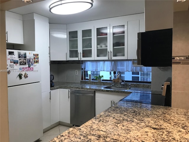 17011 N Bay Rd Unit 701, Sunny Isles Beach, FL 33160 - kitchen with dishwasher, a sink, freestanding refrigerator, white cabinetry, and range