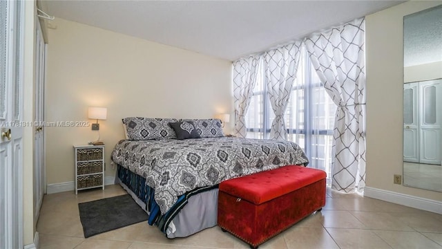 17011 N Bay Rd Unit 701, Sunny Isles Beach, FL 33160 - tiled bedroom featuring baseboards