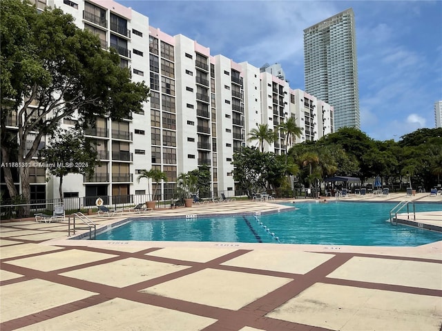 17011 N Bay Rd Unit 701, Sunny Isles Beach, FL 33160 - community pool featuring fence and a patio