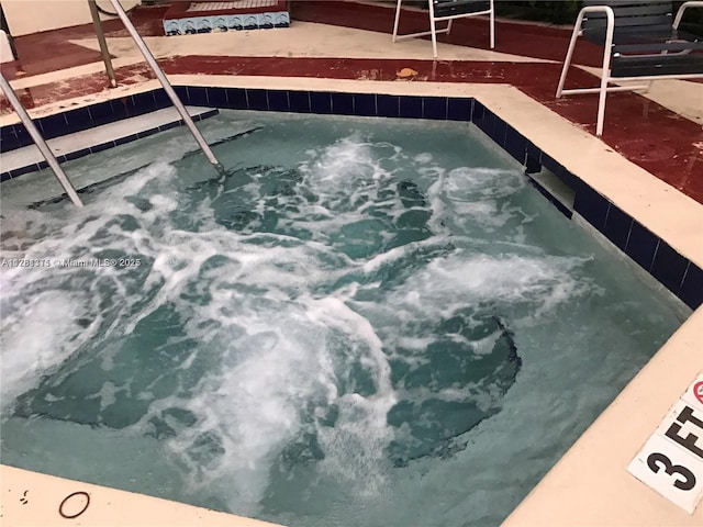 17011 N Bay Rd Unit 701, Sunny Isles Beach, FL 33160 - view of swimming pool with a community hot tub