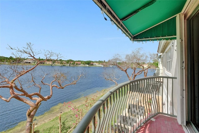 balcony featuring a water view