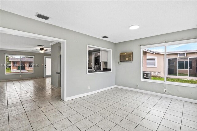 6001 NW 67th Ave, Tamarac, FL 33321 - spare room with plenty of natural light, visible vents, baseboards, and tile patterned flooring