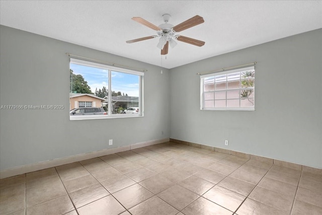 6001 NW 67th Ave, Tamarac, FL 33321 - tiled spare room featuring ceiling fan and baseboards