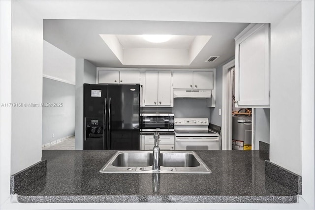 6001 NW 67th Ave, Tamarac, FL 33321 - kitchen with white electric range oven, a tray ceiling, visible vents, under cabinet range hood, and black refrigerator with ice dispenser