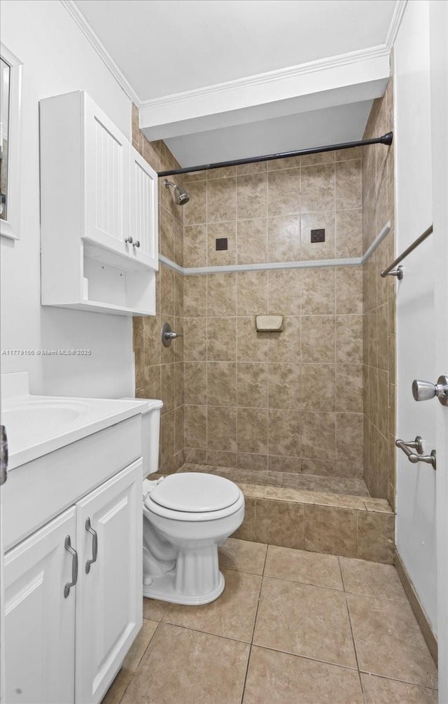 6001 NW 67th Ave, Tamarac, FL 33321 - full bathroom featuring ornamental molding, toilet, a tile shower, vanity, and tile patterned floors