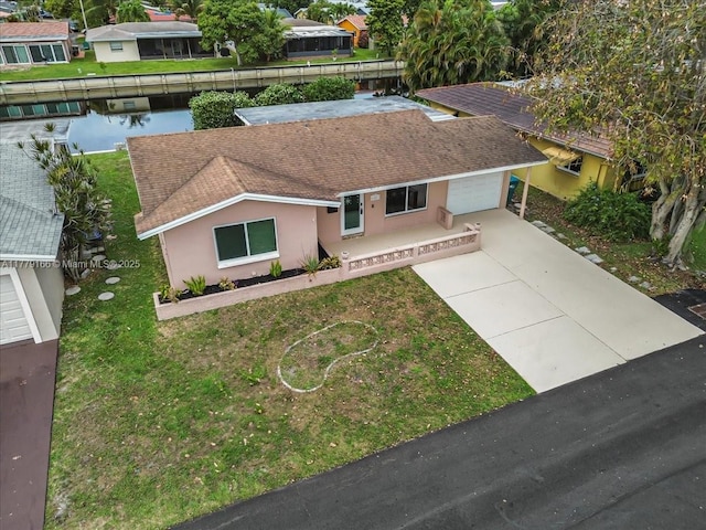 6001 NW 67th Ave, Tamarac, FL 33321 - drone / aerial view with a water view and a residential view