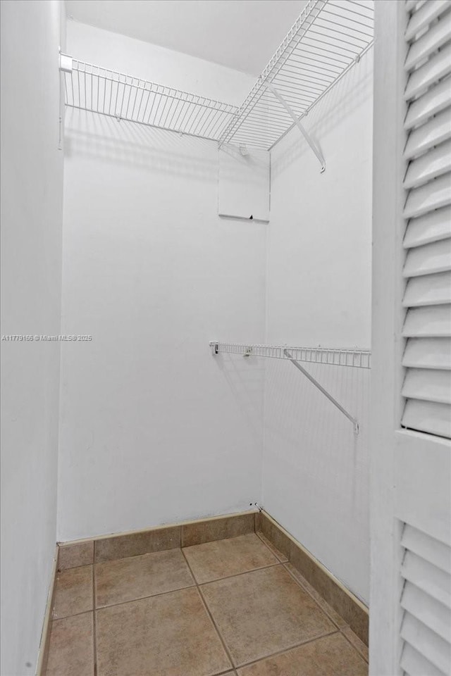 6001 NW 67th Ave, Tamarac, FL 33321 - spacious closet featuring tile patterned flooring