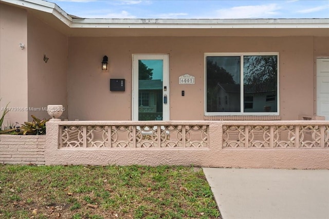 6001 NW 67th Ave, Tamarac, FL 33321 - property entrance with stucco siding