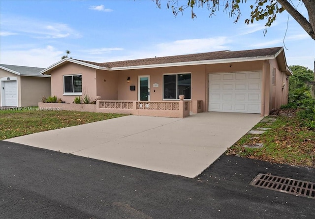 6001 NW 67th Ave, Tamarac, FL 33321 - single story home featuring concrete driveway, stucco siding, an attached garage, and covered porch