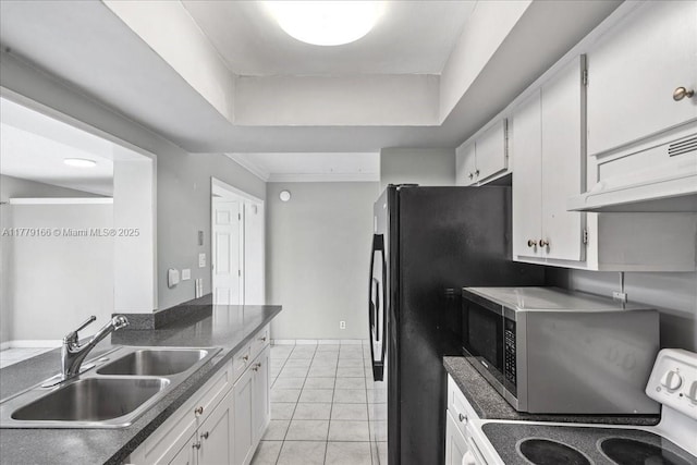 6001 NW 67th Ave, Tamarac, FL 33321 - kitchen with a sink, under cabinet range hood, stainless steel microwave, white cabinetry, and stove
