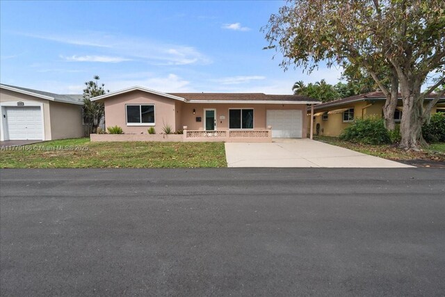 6001 NW 67th Ave, Tamarac, FL 33321 - ranch-style house featuring driveway, stucco siding, and an attached garage