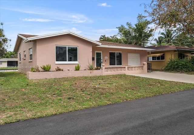 6001 NW 67th Ave, Tamarac, FL 33321 - single story home featuring a front yard, concrete driveway, and stucco siding