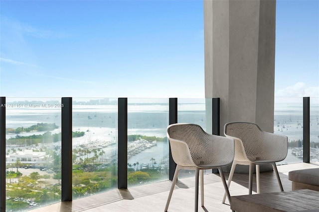 balcony featuring a water view