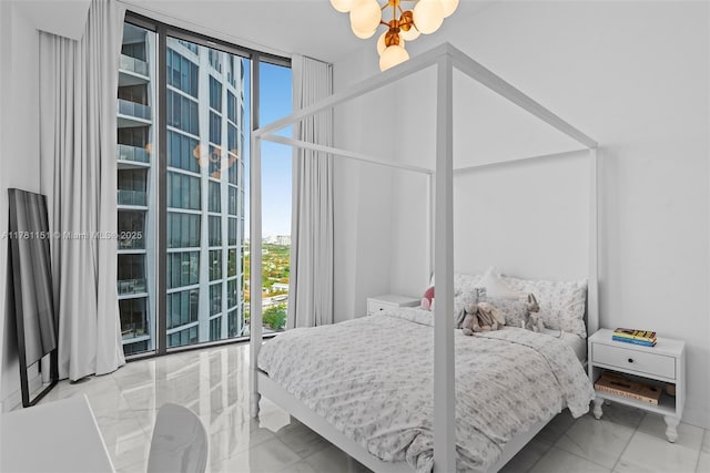 bedroom with a chandelier and marble finish floor