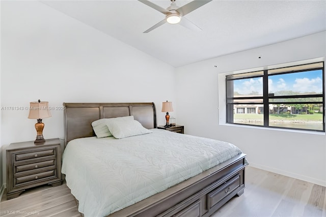 3950 Cocoplum Cir Unit F, Coconut Creek, FL 33063 - bedroom featuring lofted ceiling, light wood-style floors, baseboards, and ceiling fan