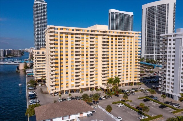 view of property featuring a city view and a water view