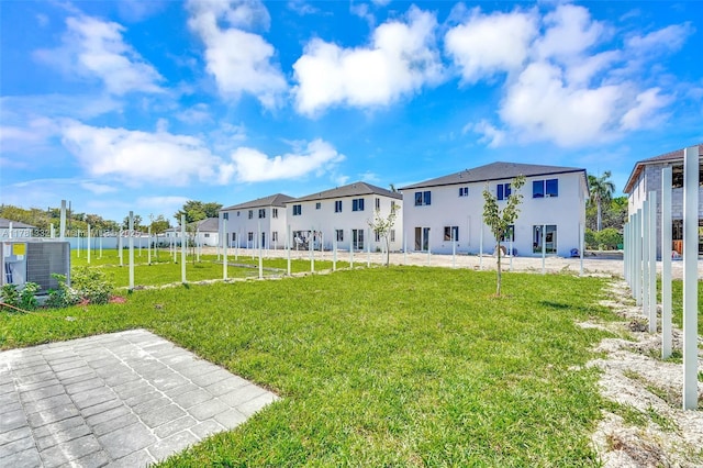 view of yard with fence and a residential view