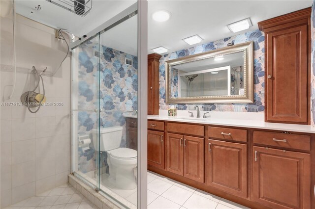 2800 E Sunrise Blvd Unit 14B, Fort Lauderdale, FL 33304 - bathroom featuring tile patterned floors, vanity, toilet, and a stall shower