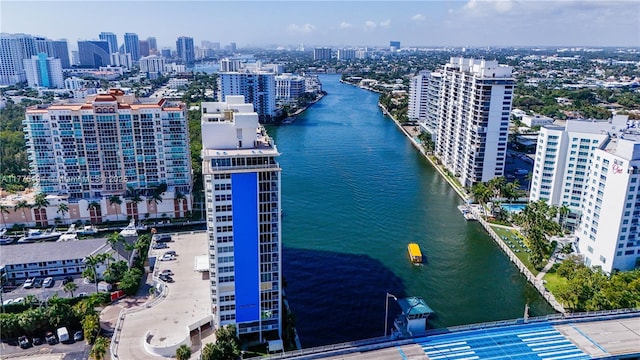 birds eye view of property with a city view and a water view