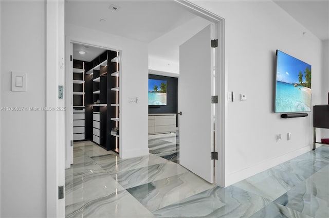 788 NE 23rd St Unit 1001, Miami, FL 33137 - hall featuring marble finish flooring and baseboards