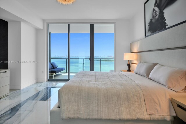 788 NE 23rd St Unit 1001, Miami, FL 33137 - bedroom featuring marble finish floors and baseboards