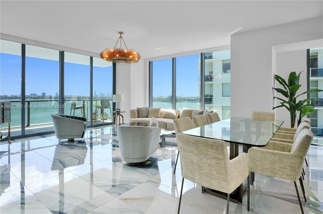 788 NE 23rd St Unit 1001, Miami, FL 33137 - dining space featuring a wall of windows and a water view