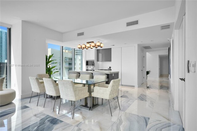 788 NE 23rd St Unit 1001, Miami, FL 33137 - dining space featuring light marble finish flooring