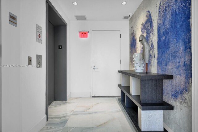 788 NE 23rd St Unit 1001, Miami, FL 33137 - hallway with elevator, marble finish flooring, and recessed lighting