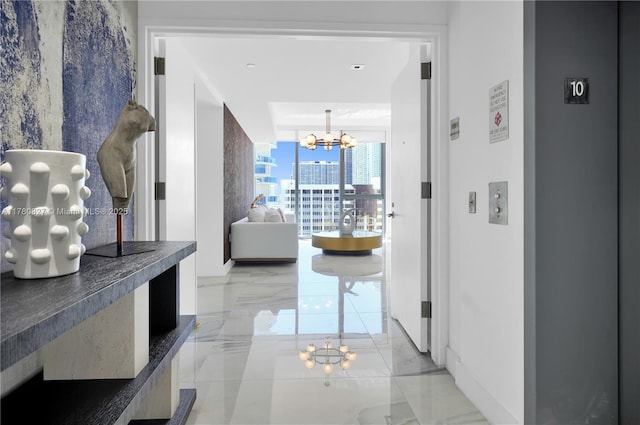 788 NE 23rd St Unit 1001, Miami, FL 33137 - hall with a chandelier, light marble finish flooring, and elevator
