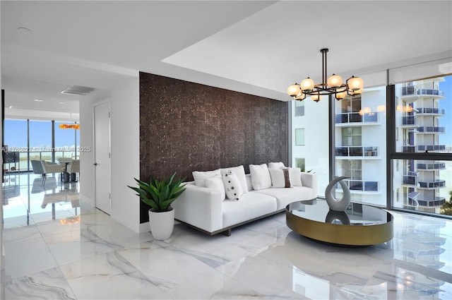 788 NE 23rd St Unit 1001, Miami, FL 33137 - living room featuring a chandelier, a wall of windows, and marble tiled flooring