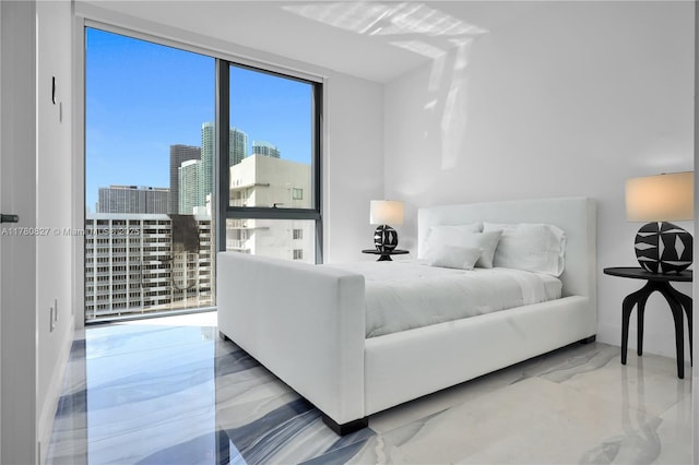 788 NE 23rd St Unit 1001, Miami, FL 33137 - bedroom featuring marble tiled flooring and a city view