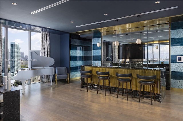 788 NE 23rd St Unit 1001, Miami, FL 33137 - indoor wet bar with wood finished floors and a wall of windows