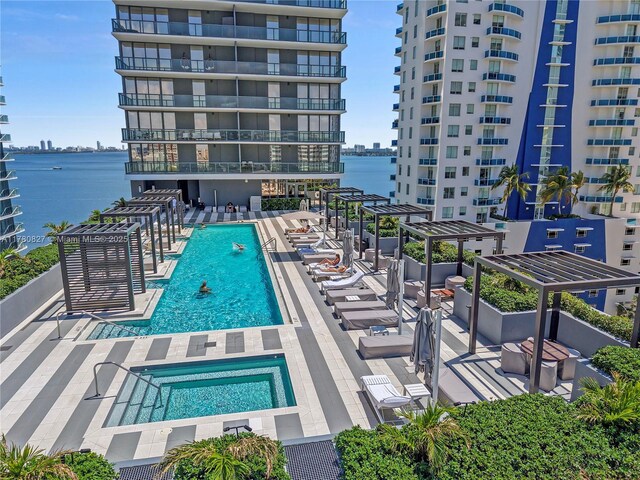 788 NE 23rd St Unit 1001, Miami, FL 33137 - community pool featuring a community hot tub, a water view, and a patio