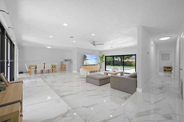 1951 NE 187th Dr, North Miami Beach, FL 33179 - living area with baseboards, a ceiling fan, a textured ceiling, recessed lighting, and marble finish floor