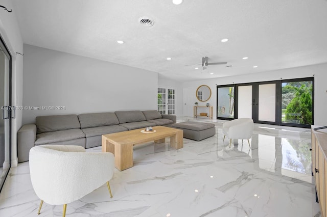 1951 NE 187th Dr, North Miami Beach, FL 33179 - living room featuring recessed lighting, french doors, a textured ceiling, a ceiling fan, and marble finish floor