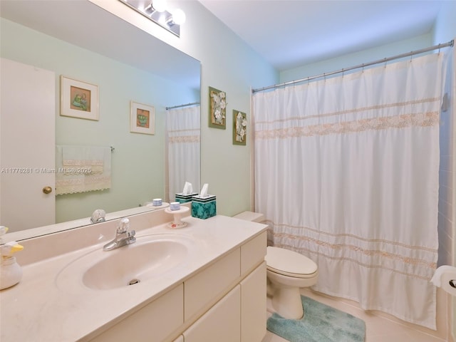 bathroom with toilet, vanity, and a shower with curtain