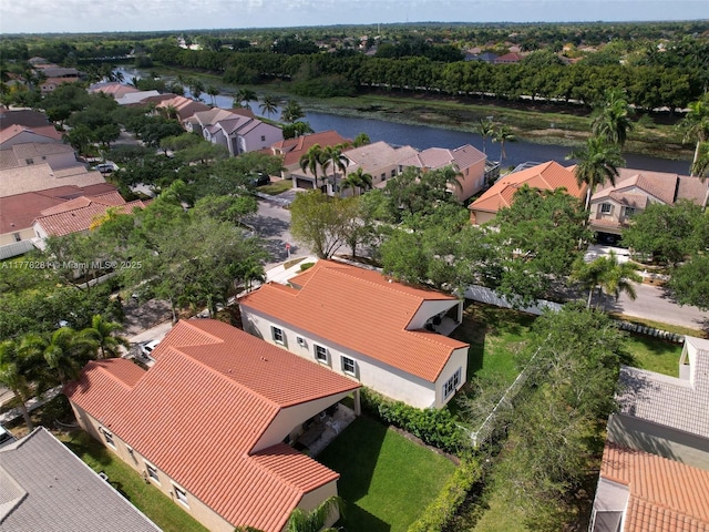 bird's eye view featuring a water view and a residential view