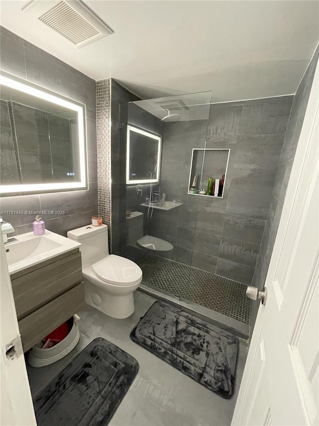 112 Royal Park Dr Unit 2G, Oakland Park, FL 33309 - bathroom with vanity, visible vents, walk in shower, and toilet