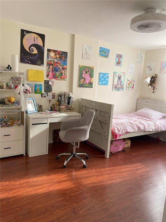 112 Royal Park Dr Unit 2G, Oakland Park, FL 33309 - bedroom featuring a textured ceiling and wood finished floors