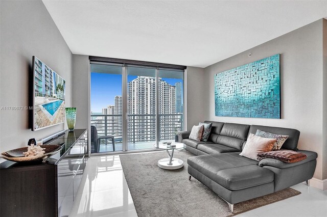 325 S Biscayne Blvd Unit 2519, Miami, FL 33131 - tiled living room with baseboards and a wall of windows