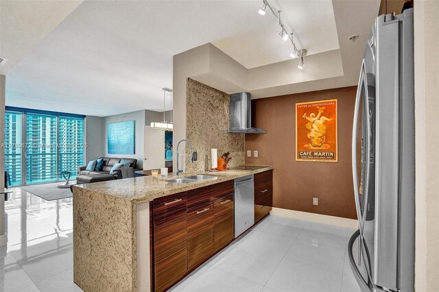 325 S Biscayne Blvd Unit 2519, Miami, FL 33131 - kitchen featuring a sink, light tile patterned floors, wall chimney exhaust hood, and stainless steel appliances