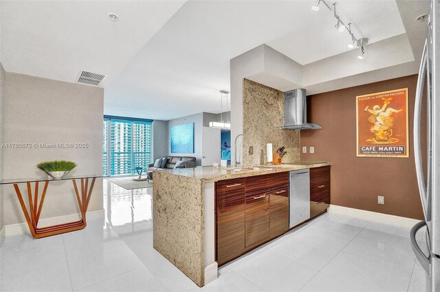 325 S Biscayne Blvd Unit 2519, Miami, FL 33131 - kitchen featuring baseboards, visible vents, brown cabinets, stainless steel appliances, and a sink