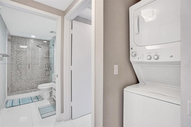 325 S Biscayne Blvd Unit 2519, Miami, FL 33131 - washroom featuring stacked washer / dryer, laundry area, tile patterned flooring, and visible vents