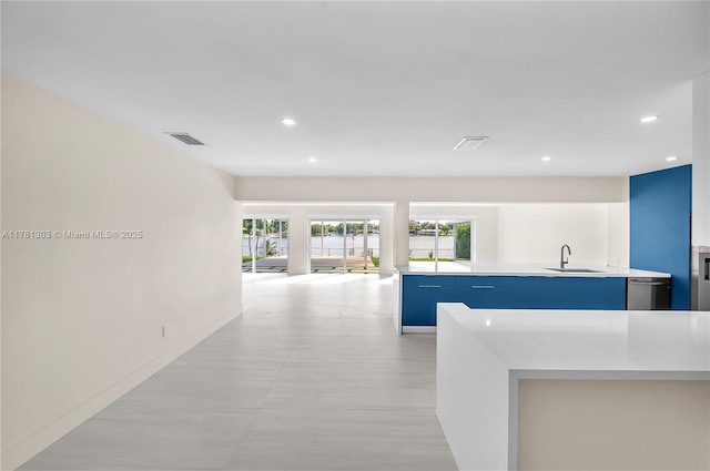5020 SW 92nd Ave, Miami, FL 33165 - kitchen featuring blue cabinetry, a sink, dishwasher, light countertops, and recessed lighting