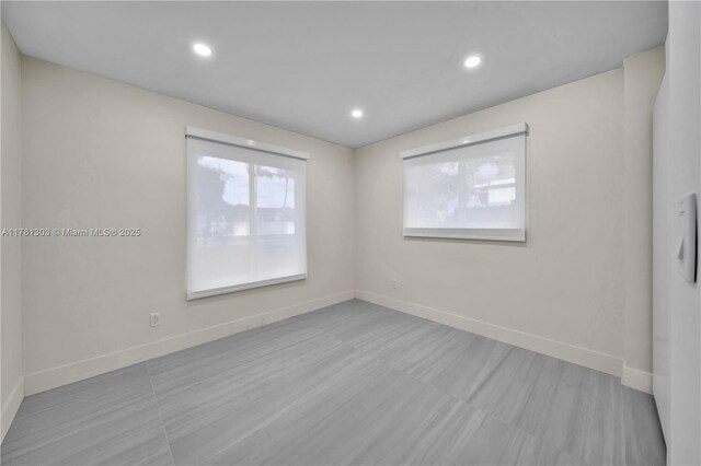 5020 SW 92nd Ave, Miami, FL 33165 - unfurnished room with baseboards and recessed lighting