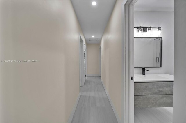 5020 SW 92nd Ave, Miami, FL 33165 - hall with a sink, recessed lighting, and baseboards
