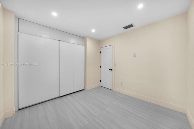 5020 SW 92nd Ave, Miami, FL 33165 - unfurnished bedroom with baseboards, recessed lighting, a closet, and light flooring