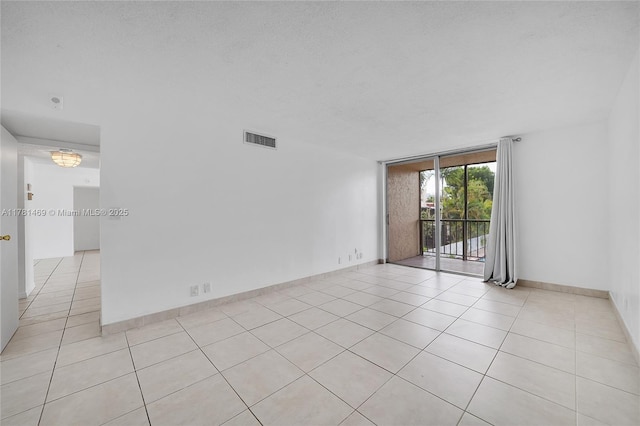 2001 Atlantic Shores Blvd Unit 220, Hallandale Beach, FL 33009 - empty room with visible vents, baseboards, light tile patterned floors, and floor to ceiling windows