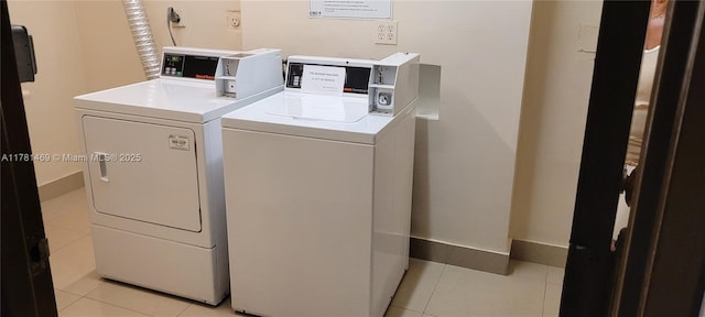 2001 Atlantic Shores Blvd Unit 220, Hallandale Beach, FL 33009 - shared laundry area featuring light tile patterned floors and washer and dryer