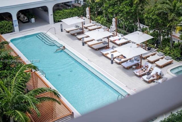community pool with a patio area